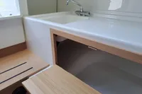 2023 Nimbus Commuter 8 interior sink with wooden cabinetry and modern faucet.