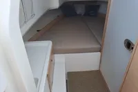 2023 Nimbus Commuter 8 cabin interior with bed and sink.