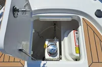 Anchor compartment of 2023 Nimbus Commuter 8 boat with chain and storage.