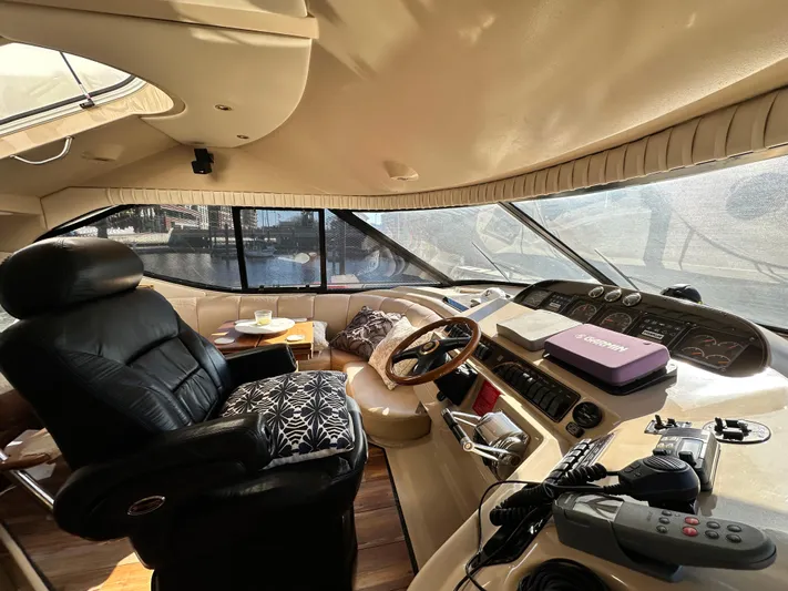  Yacht Photos Pics Interior of 1999 Cruisers 5000 Sedan Sport yacht with leather seating and navigation controls.