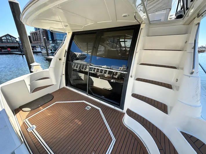  Yacht Photos Pics 1999 Cruisers 5000 Sedan Sport yacht with sleek deck and modern design.