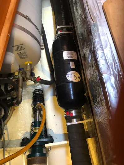 Maloose Yacht Photos Pics Engine compartment of a 2001 Malo 43 sailboat, showing pipes and mechanical components.