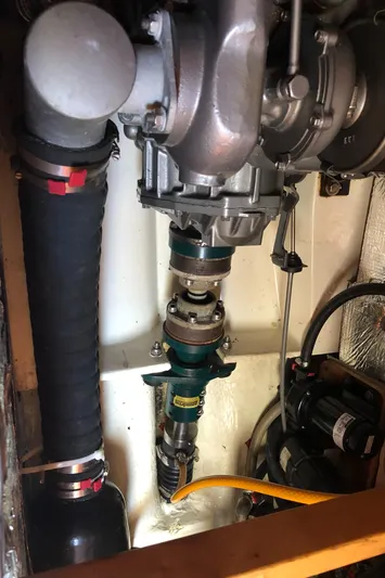 Maloose Yacht Photos Pics Engine compartment of a 2001 Malo 43 boat, showing mechanical components and hoses.