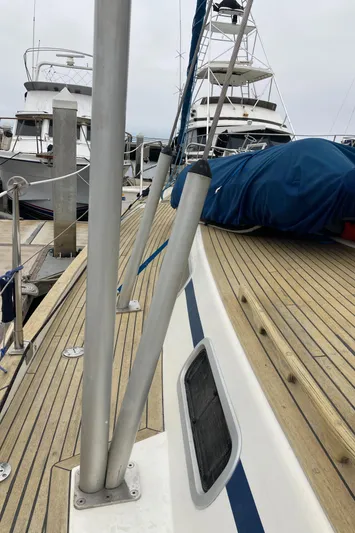 Maloose Yacht Photos Pics 2001 Malo 43 sailboat deck with wooden finish and marina view.