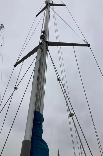 Maloose Yacht Photos Pics Malo 43 sailboat mast and rigging against cloudy sky, 2001 model.
