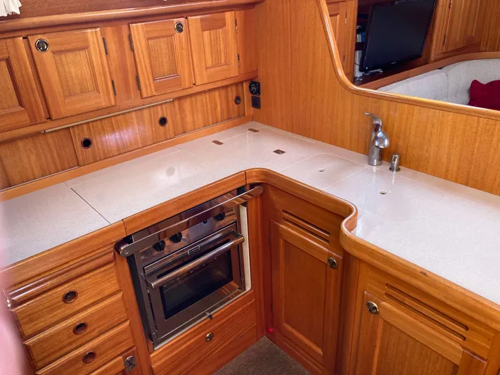 Maloose Yacht Photos Pics Wooden yacht kitchen interior with stove, Malo 43, 2001 model.