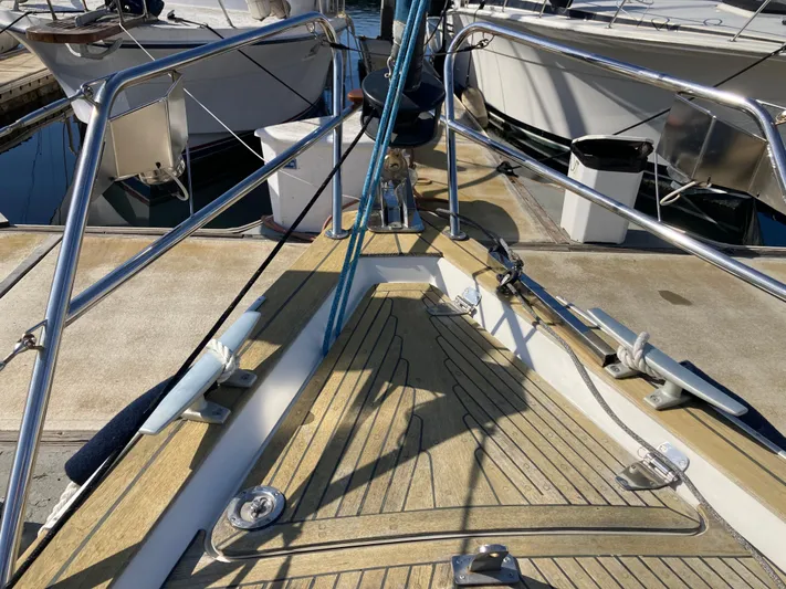 Maloose Yacht Photos Pics Deck of a 2001 Malo 43 sailboat with mooring lines and railings.