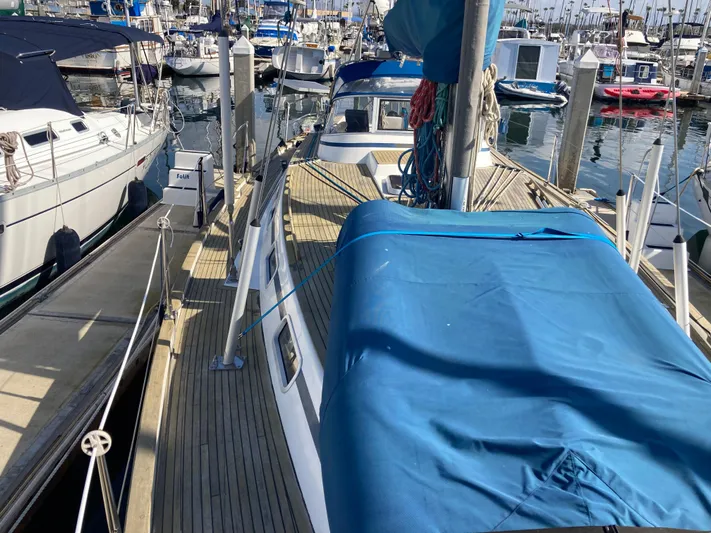 Maloose Yacht Photos Pics Sailboat Malo 43, 2001 model, docked at marina with blue cover.