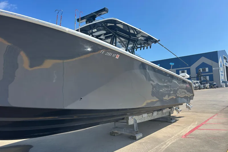 Yacht Photos Pics 2016 SeaHunter 39 Tournament boat on trailer, parked outdoors under clear blue sky.
