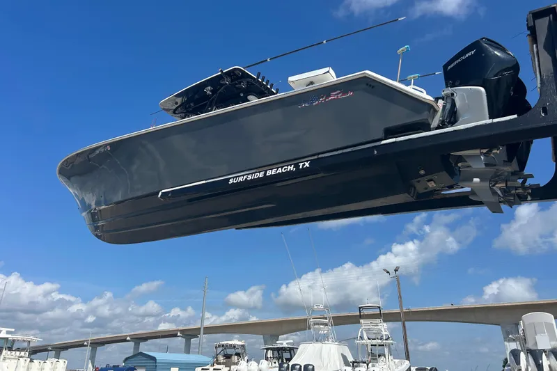  Yacht Photos Pics 2016 SeaHunter 39 Tournament boat on lift, Surfside Beach, TX, under clear blue sky.