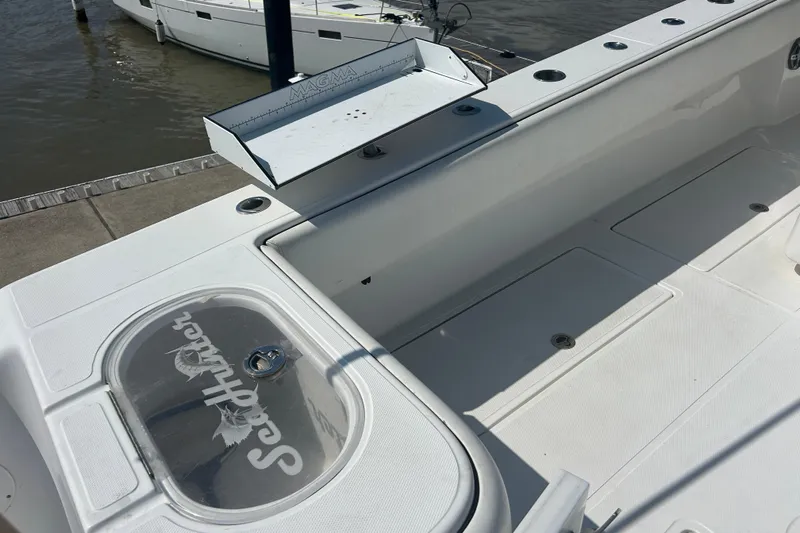  Yacht Photos Pics 2016 SeaHunter 39 Tournament boat deck with fishing rod holders and storage compartments.