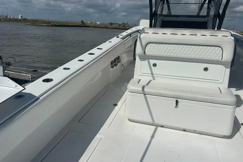  Yacht Photos Pics 2016 SeaHunter 39 Tournament boat interior with seating and rod holders, docked by the water.