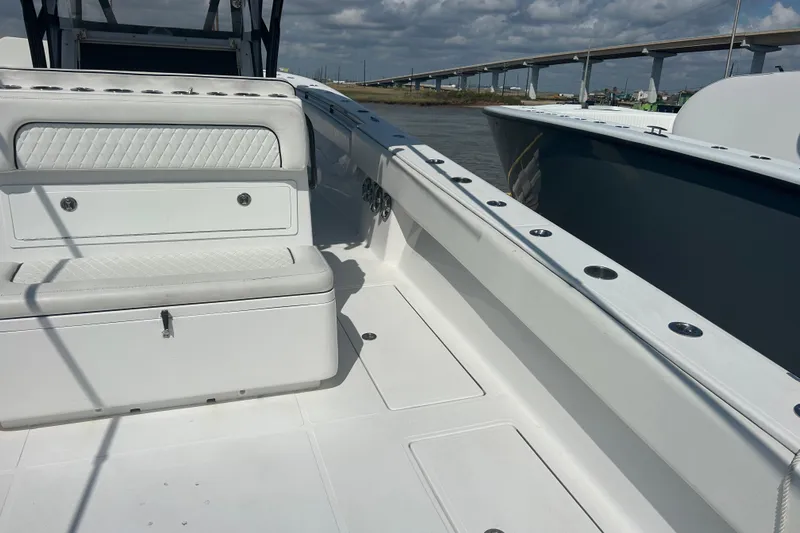  Yacht Photos Pics 2016 SeaHunter 39 Tournament boat interior with seating, docked near a bridge.