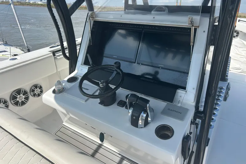  Yacht Photos Pics 2016 SeaHunter 39 Tournament boat helm with Garmin displays and steering wheel.