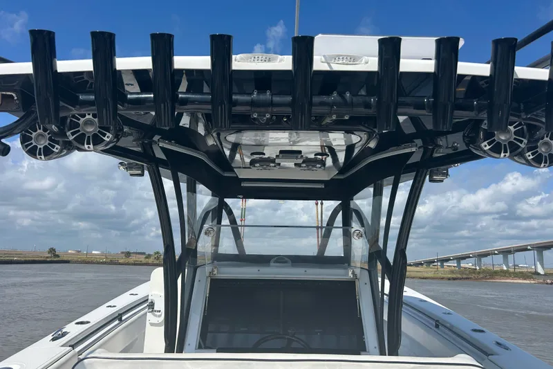  Yacht Photos Pics 2016 SeaHunter 39 Tournament boat with rod holders and speakers, under a clear blue sky.