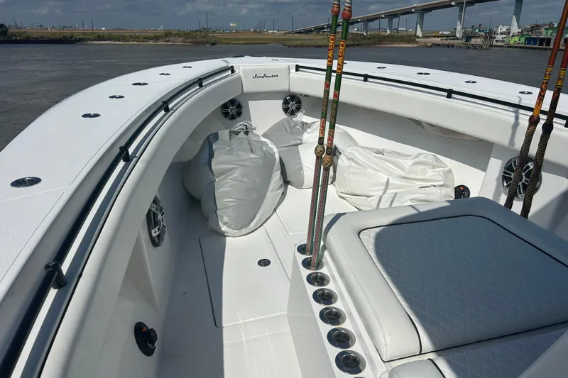  Yacht Photos Pics 2016 SeaHunter 39 Tournament boat interior with fishing rods and seating, near a bridge.