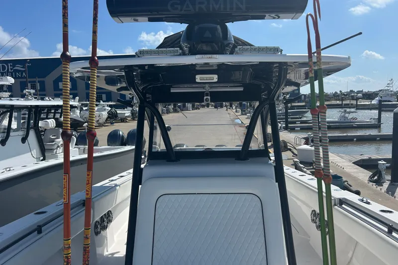  Yacht Photos Pics 2016 SeaHunter 39 Tournament boat at marina, featuring fishing rods and Garmin equipment.