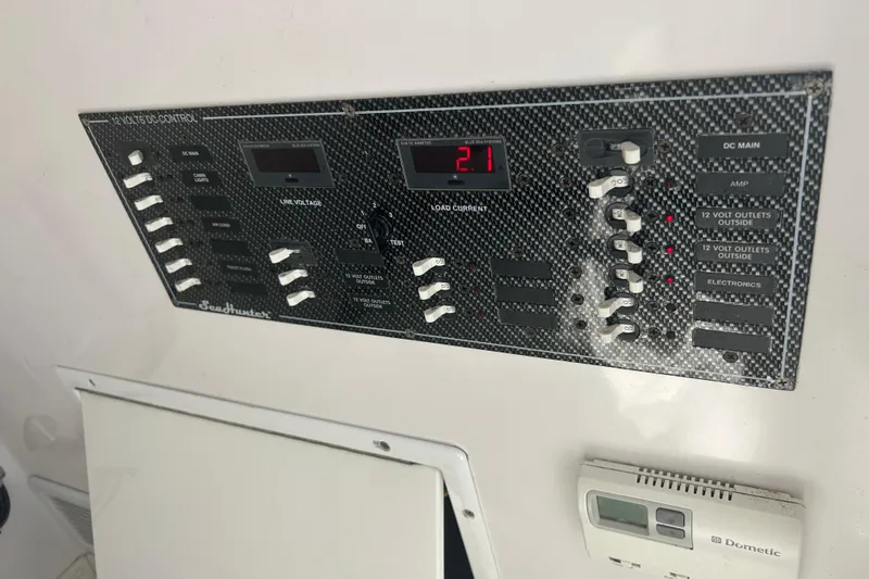  Yacht Photos Pics Control panel of a 2016 SeaHunter 39 Tournament boat, featuring various switches and displays.