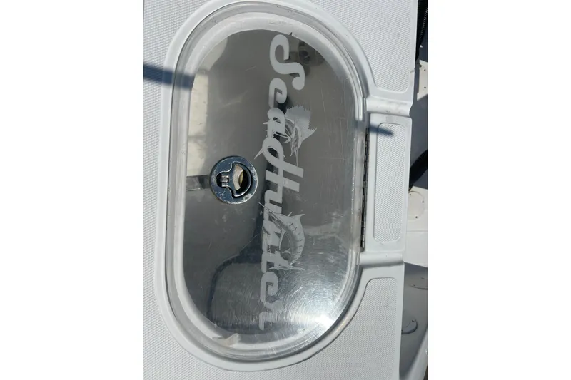  Yacht Photos Pics 2016 SeaHunter 39 Tournament boat compartment with logo on transparent cover.