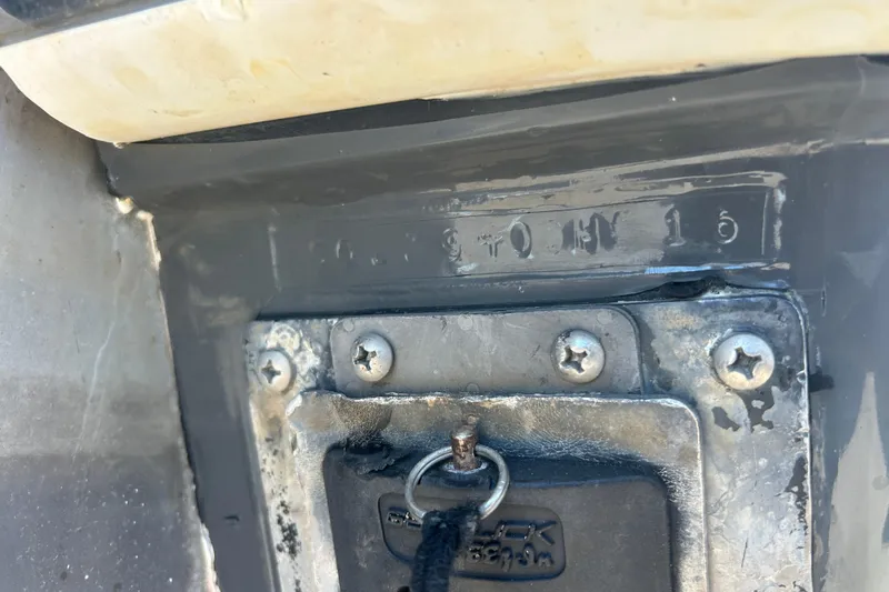  Yacht Photos Pics Close-up of a 2016 SeaHunter 39 Tournament boat's identification plate with visible screws.