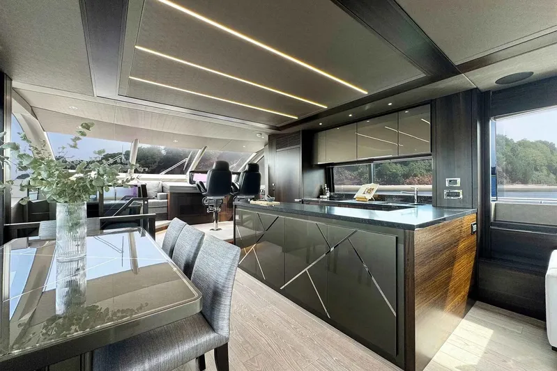  Yacht Photos Pics Luxurious interior of 2023 Sunseeker 76 Yacht with modern kitchen and dining area.