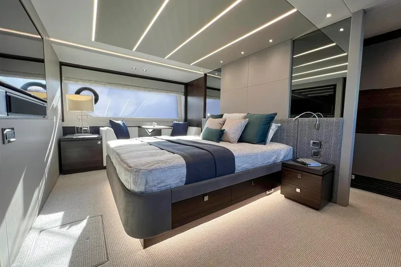  Yacht Photos Pics Luxurious bedroom interior of 2023 Sunseeker 76 Yacht with modern design and ambient lighting.