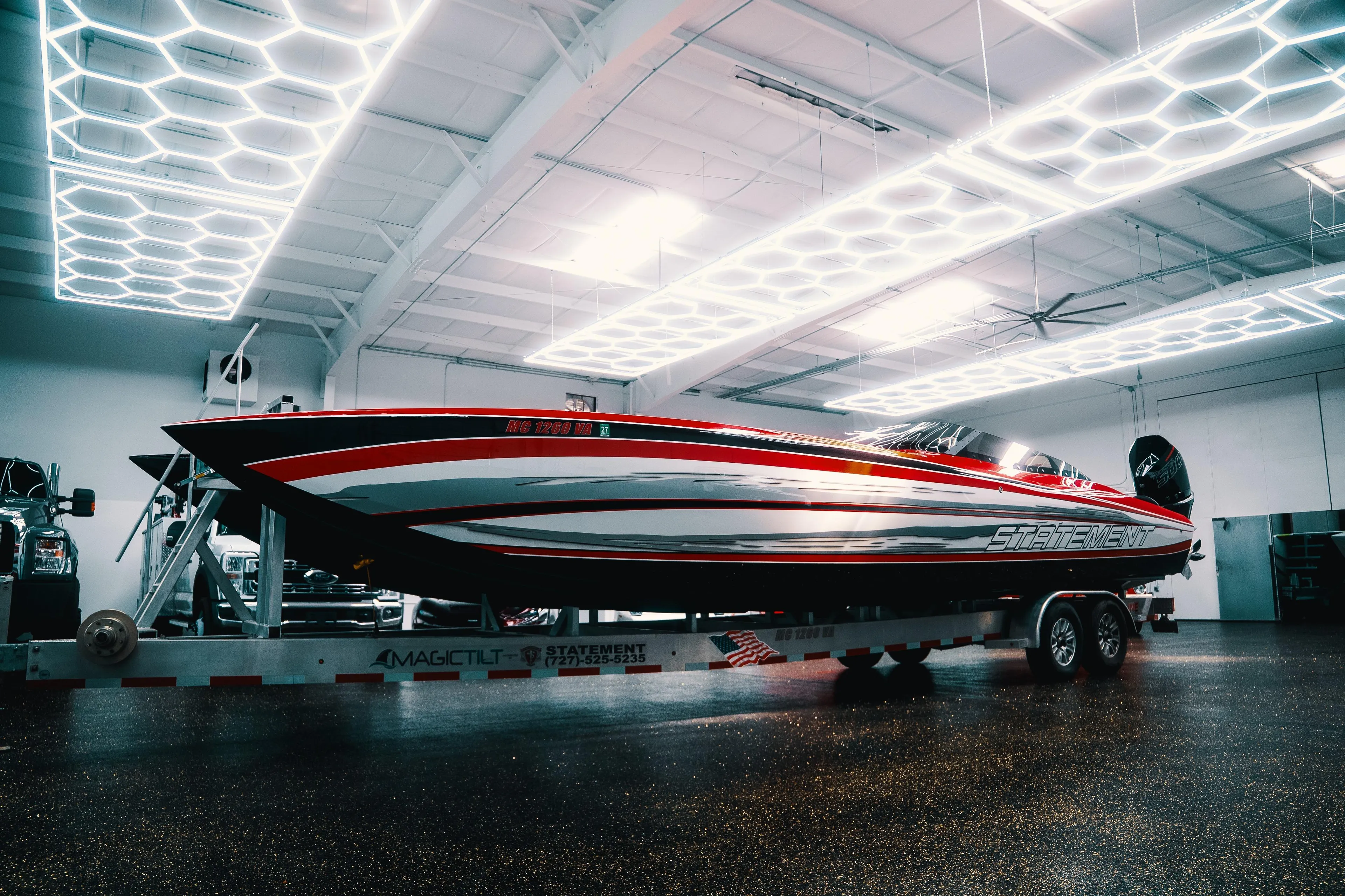 High-performance Statement 360 CAT boat in a modern showroom, 2025 model.