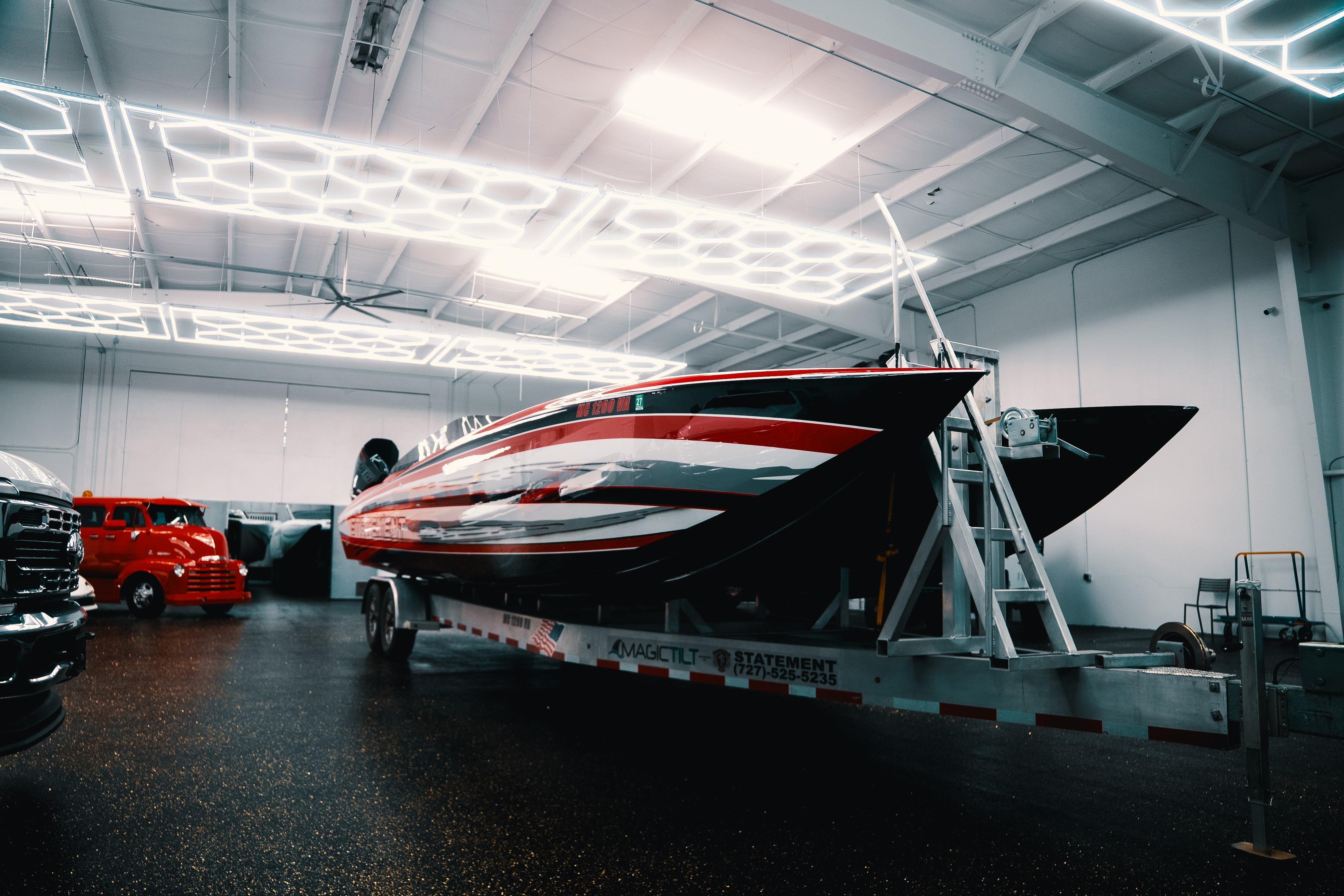 2025 Statement 360 CAT boat in a modern showroom with geometric ceiling lights.