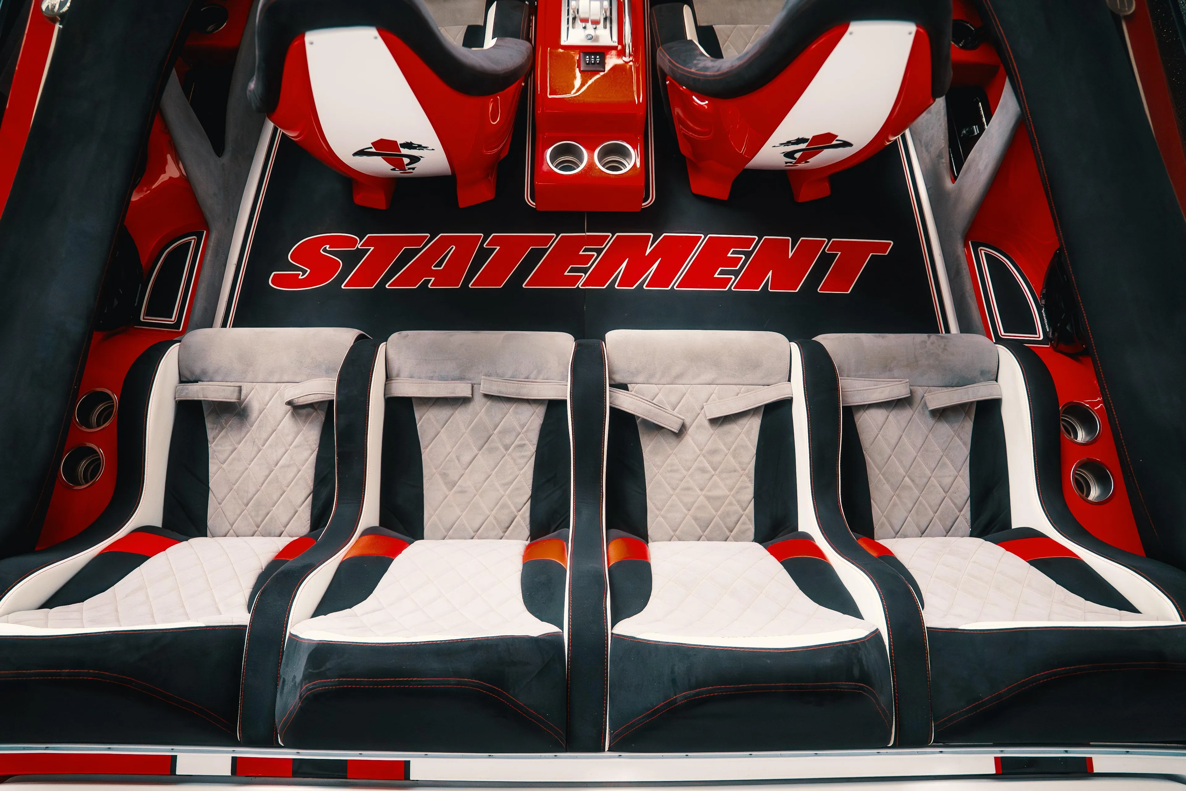 Luxurious interior of 2025 Statement 360 CAT with stylish seating and bold branding.