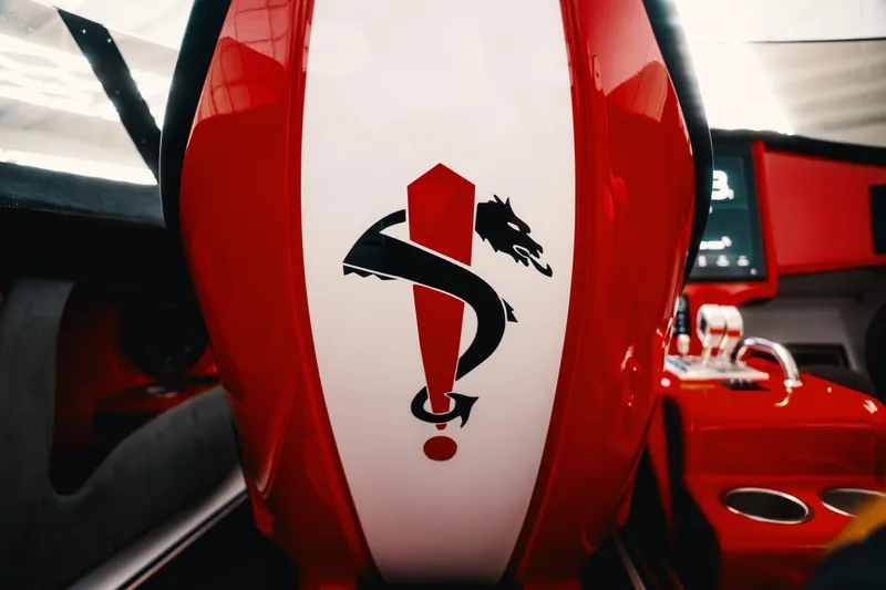  Yacht Photos Pics Red and white interior of 2025 Statement 360 CAT with dragon emblem.