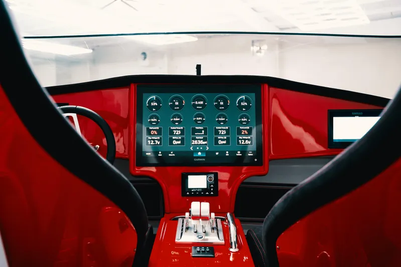  Yacht Photos Pics Red cockpit interior of 2025 Statement 360 CAT with advanced digital dashboard.