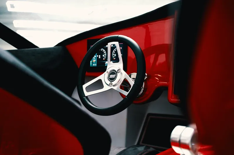  Yacht Photos Pics Steering wheel of 2025 Statement 360 CAT with modern dashboard design.