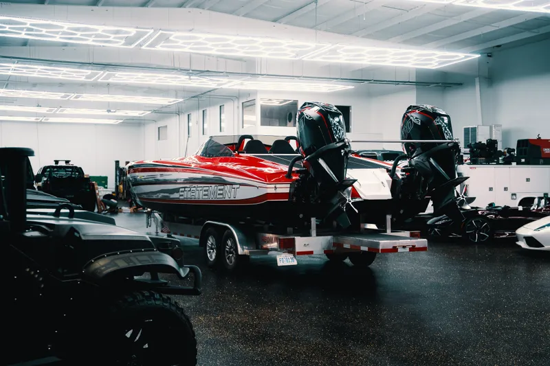  Yacht Photos Pics Red Statement 360 CAT boat on trailer in a well-lit garage, 2025 model.