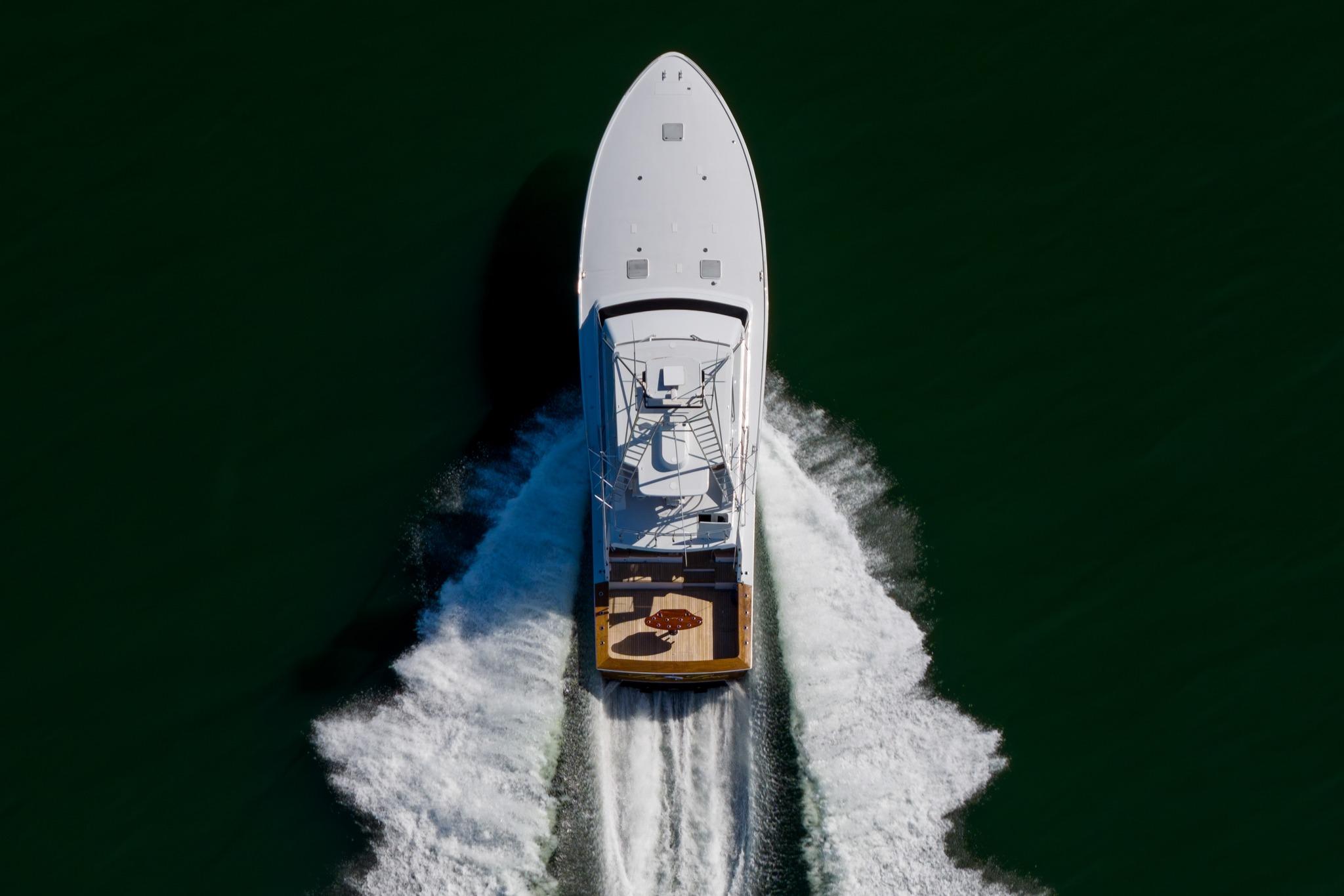 Aerial view of 1996 Jim Smith 60 Sportfish yacht cruising on open water.