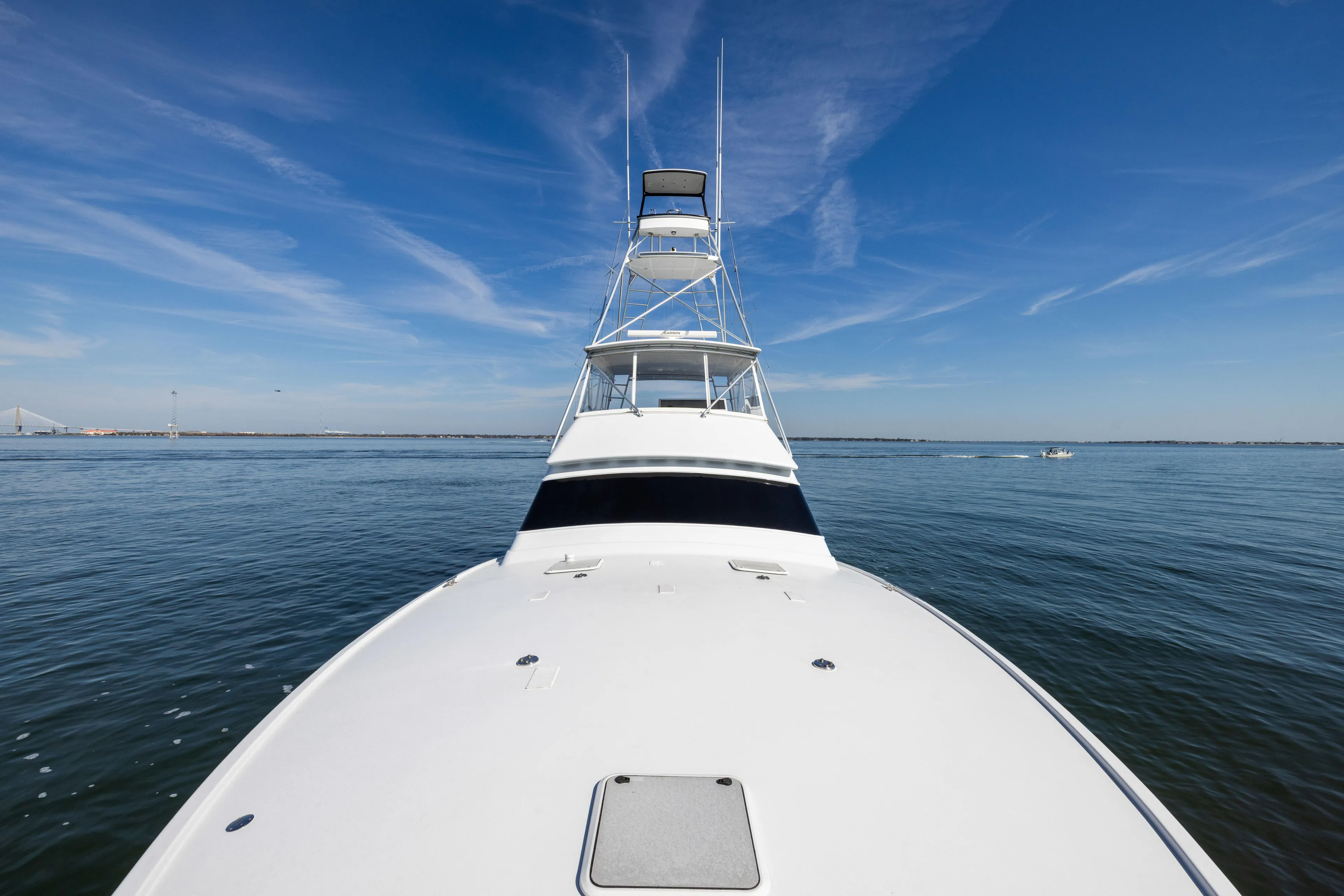 Lay Line Yacht Photos Pics 1996 Jim Smith 60 Sportfish yacht on calm ocean under clear blue sky.