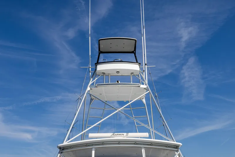 Lay Line Yacht Photos Pics Jim Smith 60 Sportfish 1996 boat tower against a clear blue sky.
