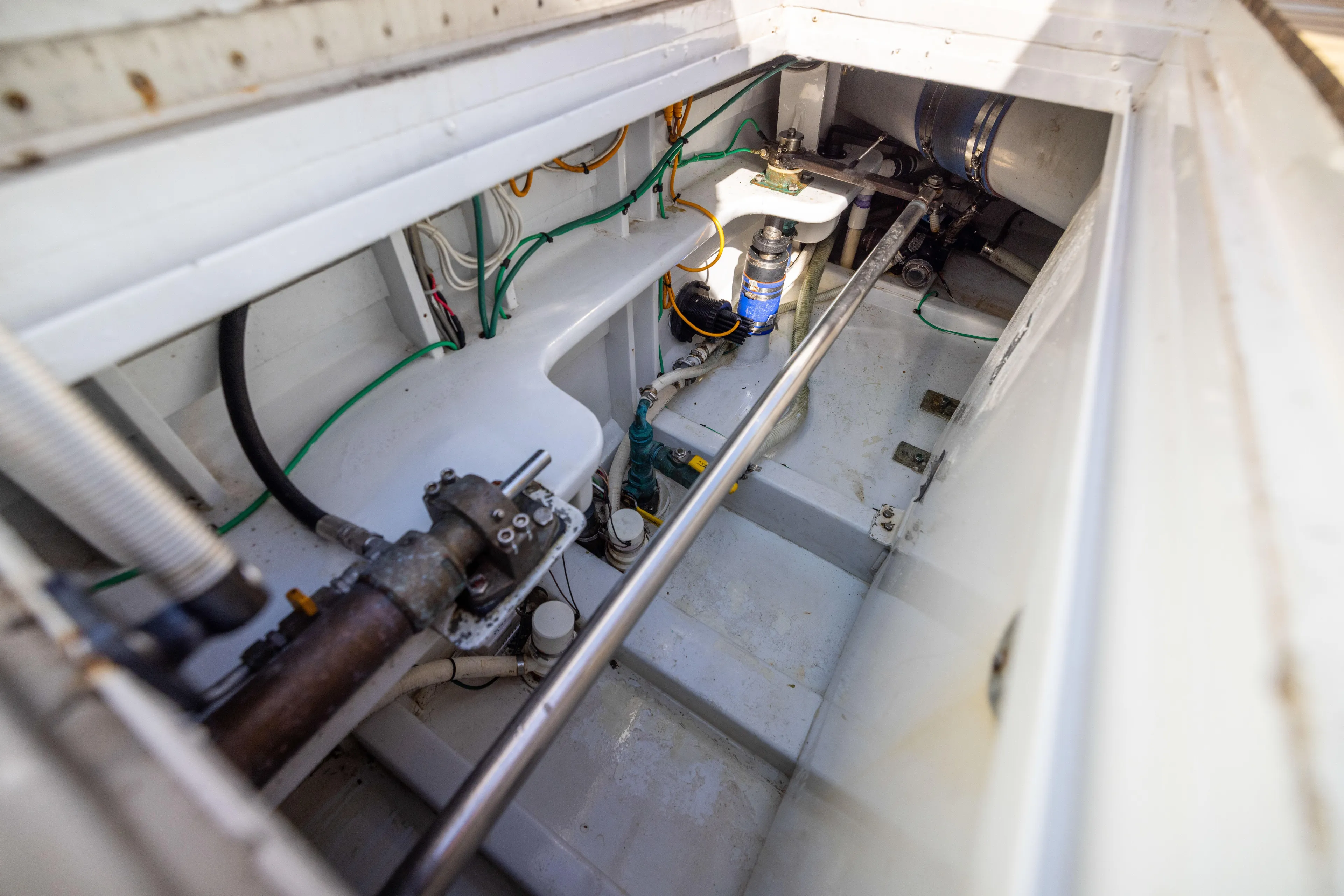 Lay Line Yacht Photos Pics Engine compartment of 1996 Jim Smith 60 Sportfish boat, showcasing mechanical components.