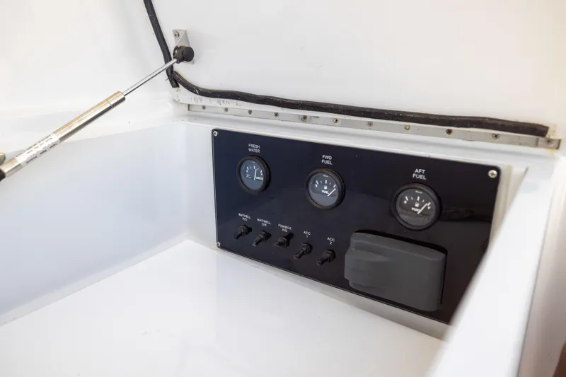 Lay Line Yacht Photos Pics Control panel of a 1996 Jim Smith 60 Sportfish boat, featuring fuel and water gauges.