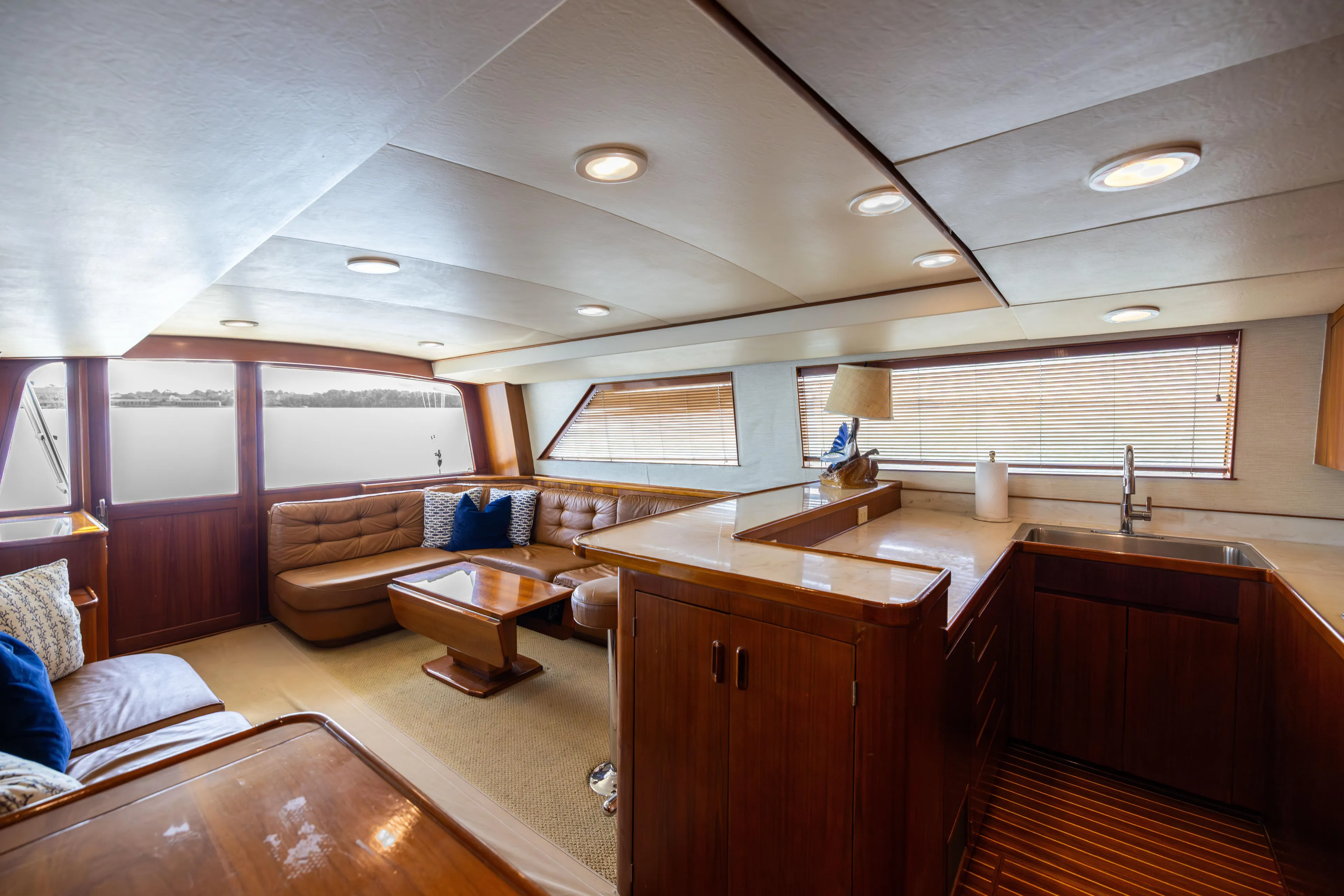 Lay Line Yacht Photos Pics Luxurious interior of a 1996 Jim Smith 60 Sportfish yacht with elegant wood finishes.