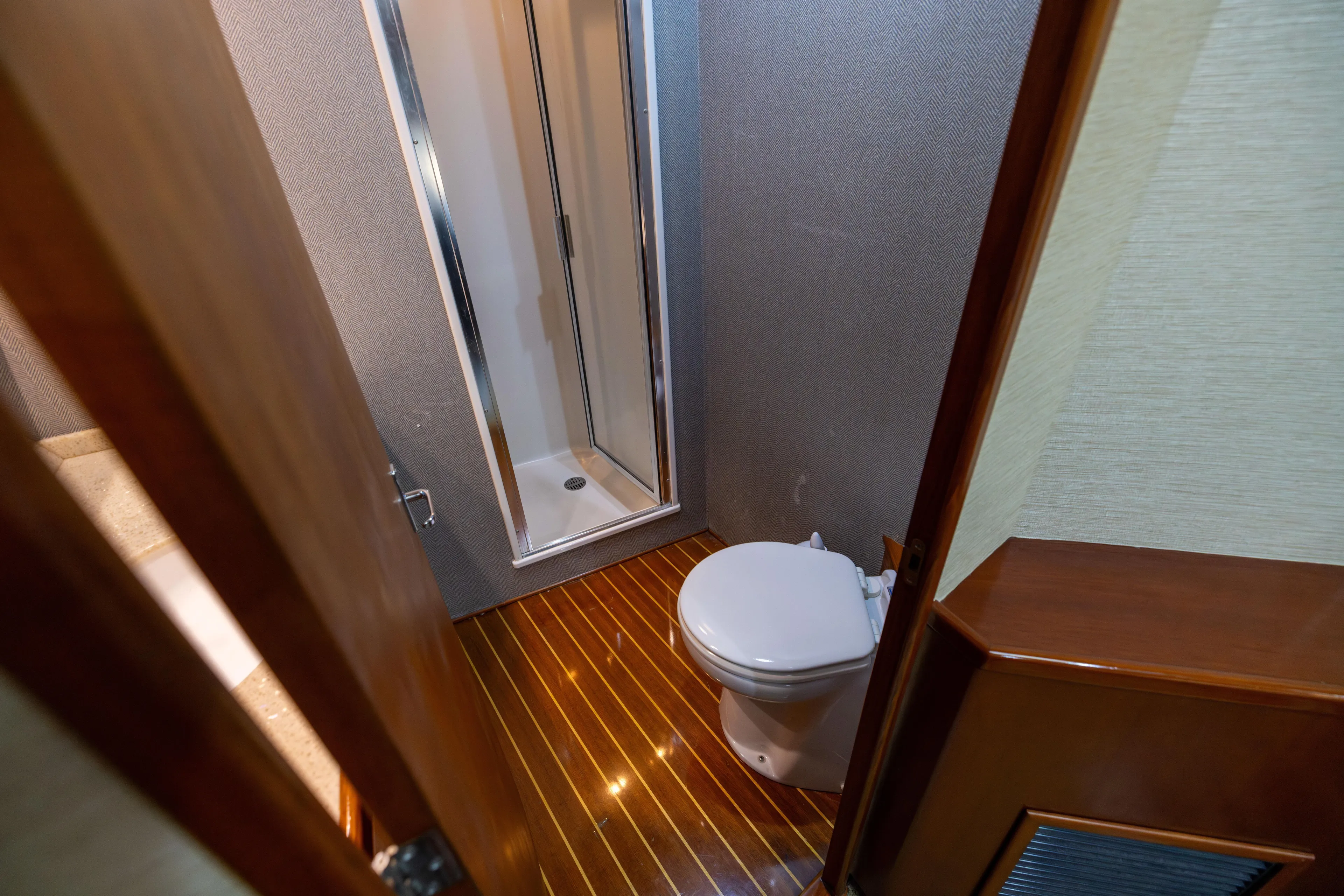 Lay Line Yacht Photos Pics Bathroom interior of 1996 Jim Smith 60 Sportfish yacht with shower and toilet.