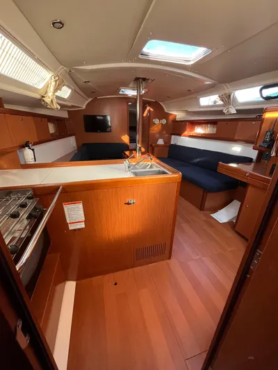 Rosebud Yacht Photos Pics Interior of 2008 Beneteau Oceanis 37 sailboat with wood finish and modern amenities.