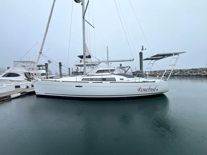 Rosebud Yacht Photos Pics 2008 Beneteau Oceanis 37 sailboat docked in a marina on a foggy day.