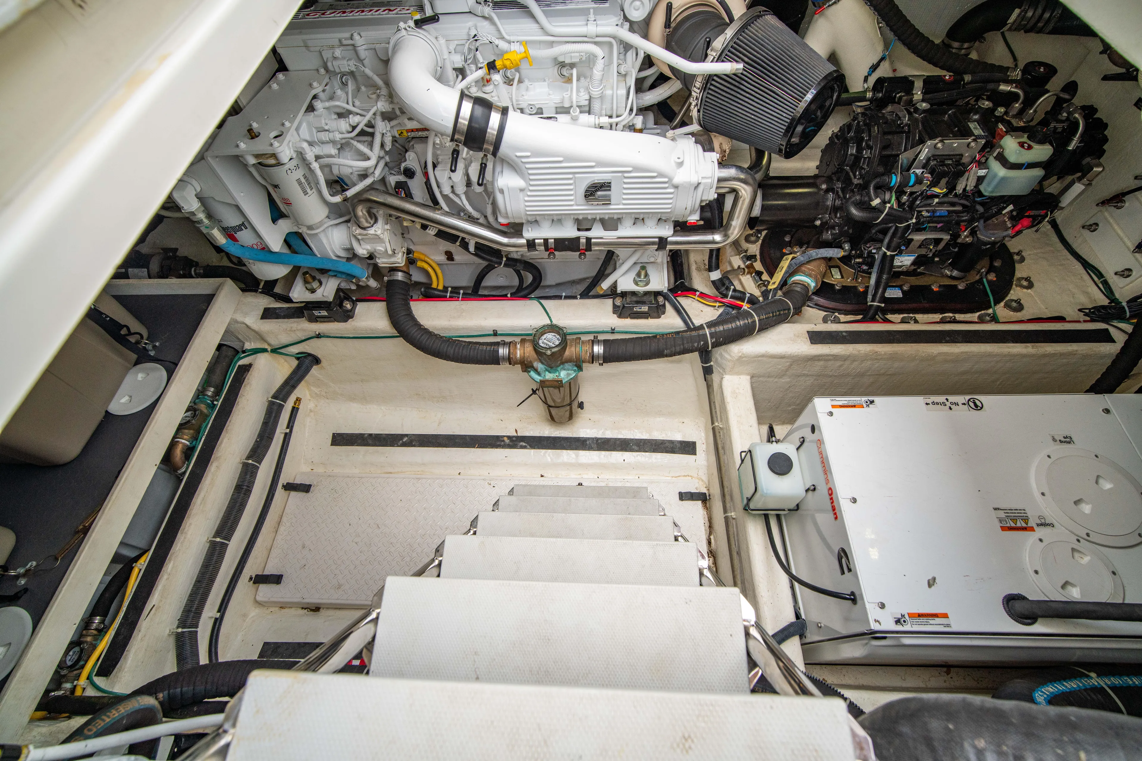  Yacht Photos Pics Engine room of 2015 Sabre 48 Salon Express yacht, showcasing mechanical components and systems.
