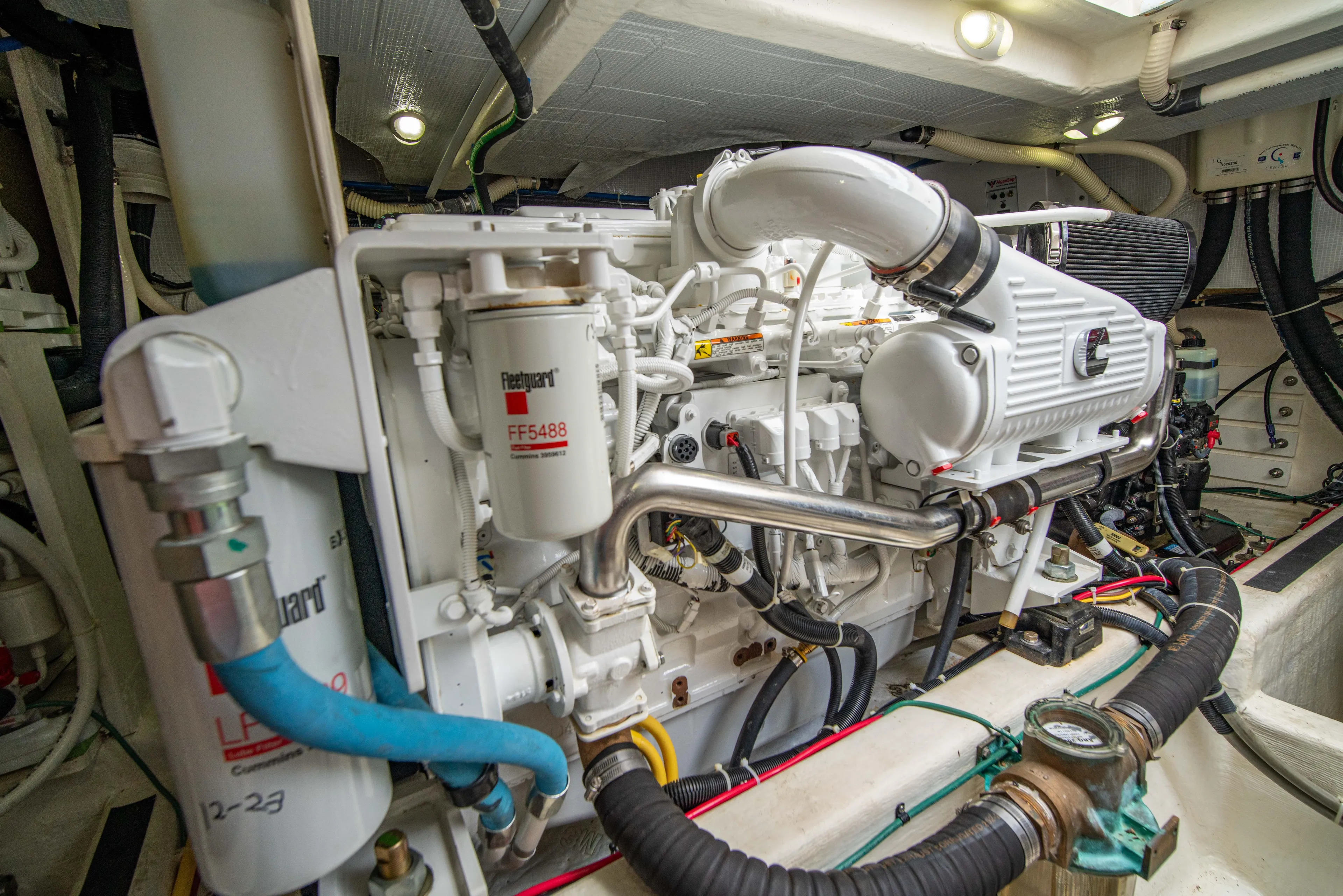  Yacht Photos Pics Engine room of 2015 Sabre 48 Salon Express yacht, showcasing detailed machinery and components.