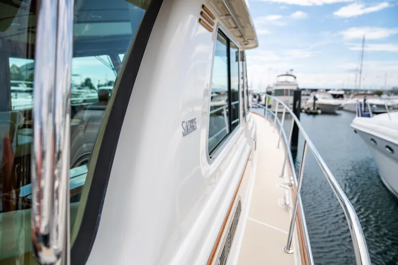  Yacht Photos Pics Sabre 48 Salon Express 2015 yacht docked at marina, side view.