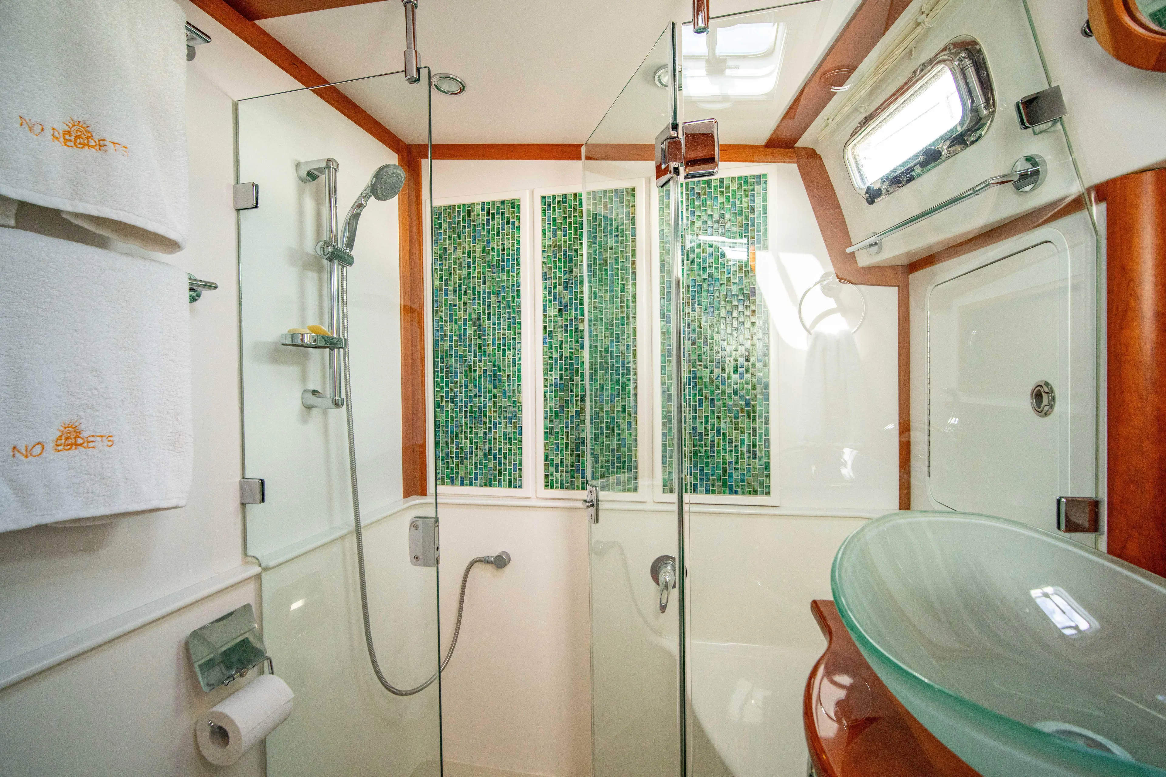  Yacht Photos Pics Luxurious bathroom in 2015 Sabre 48 Salon Express yacht with glass shower and modern fixtures.