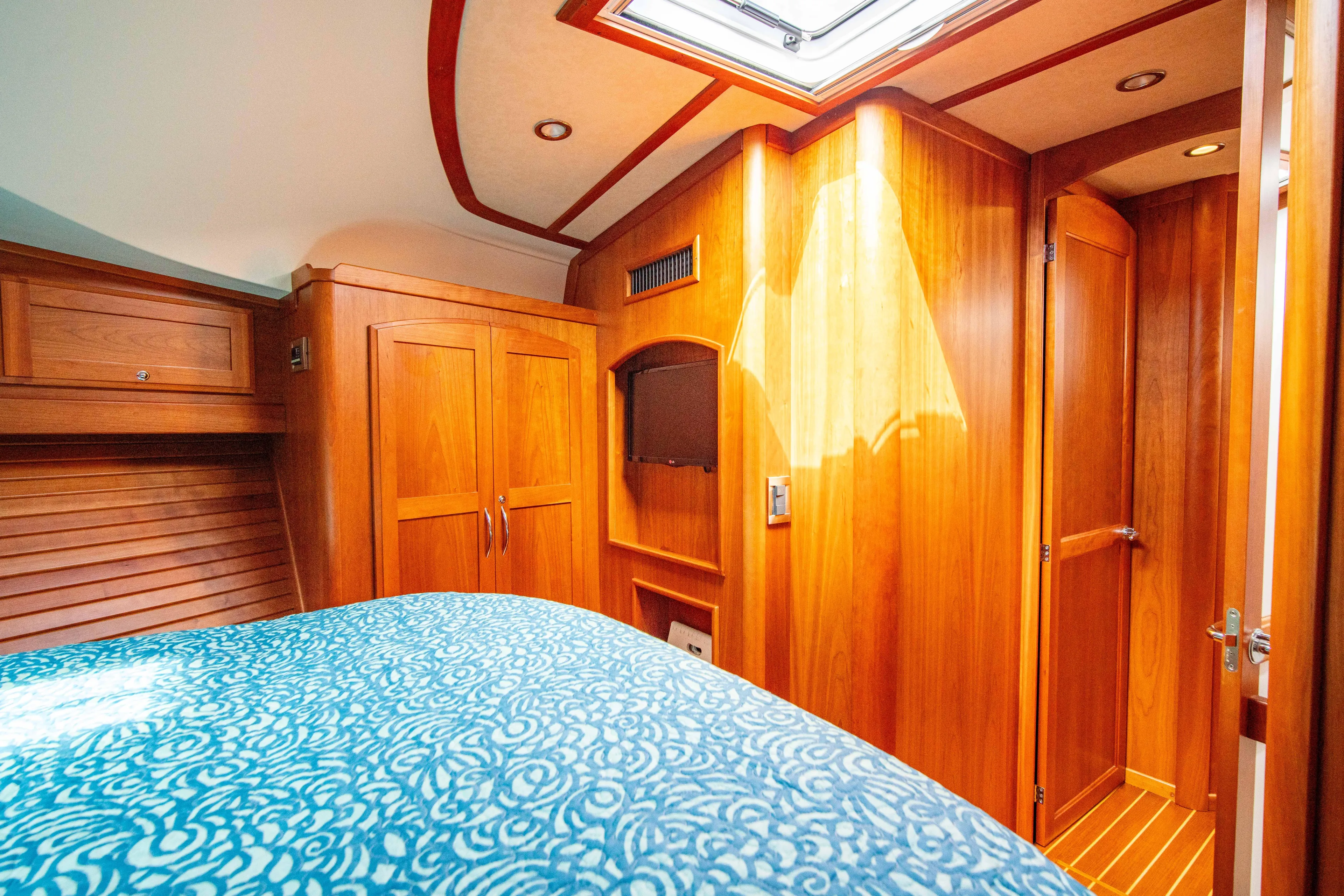 Yacht Photos Pics Luxurious 2015 Sabre 48 Salon Express cabin interior with wood finish and skylight.