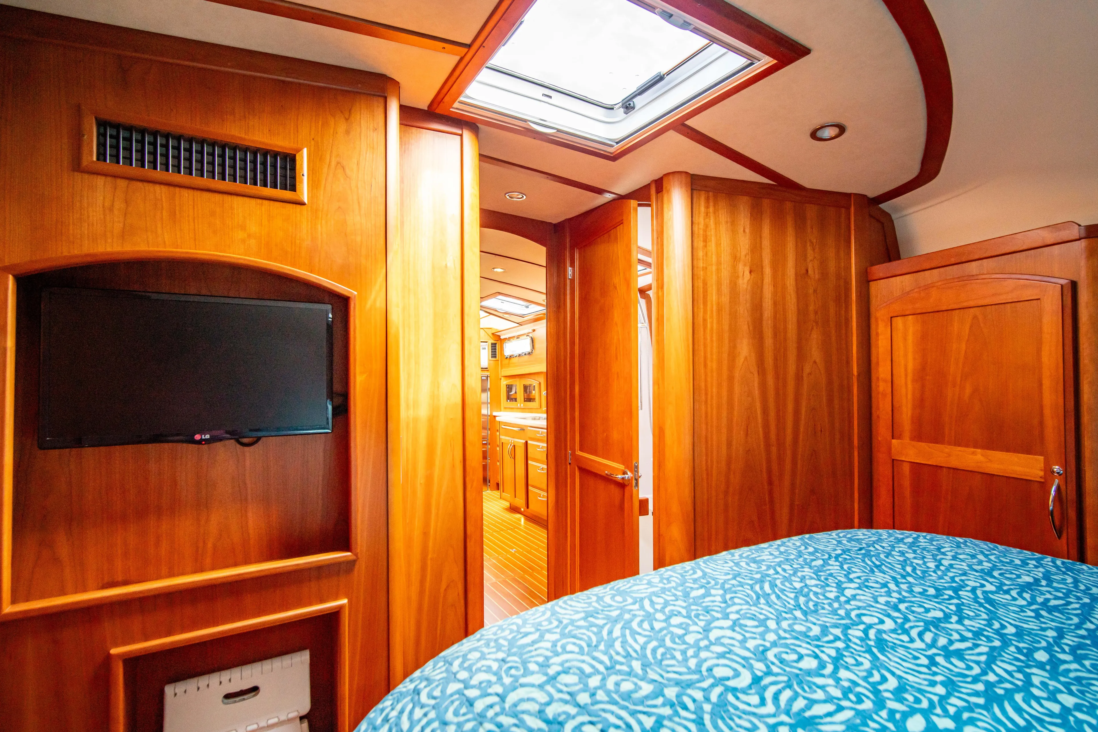  Yacht Photos Pics Interior of 2015 Sabre 48 Salon Express, featuring wood paneling and a cozy cabin.