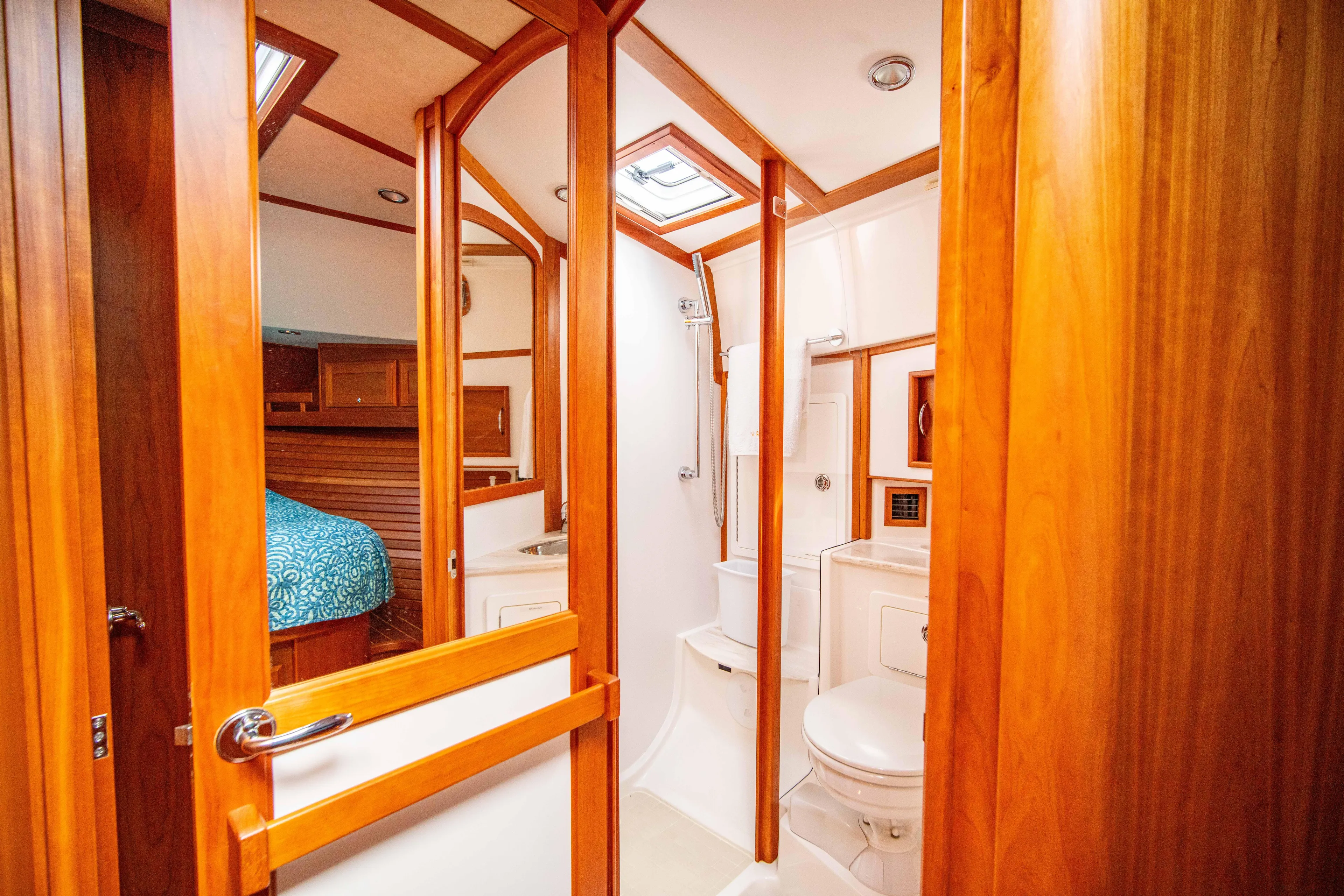  Yacht Photos Pics 2015 Sabre 48 Salon Express yacht bathroom with wooden accents and skylight.
