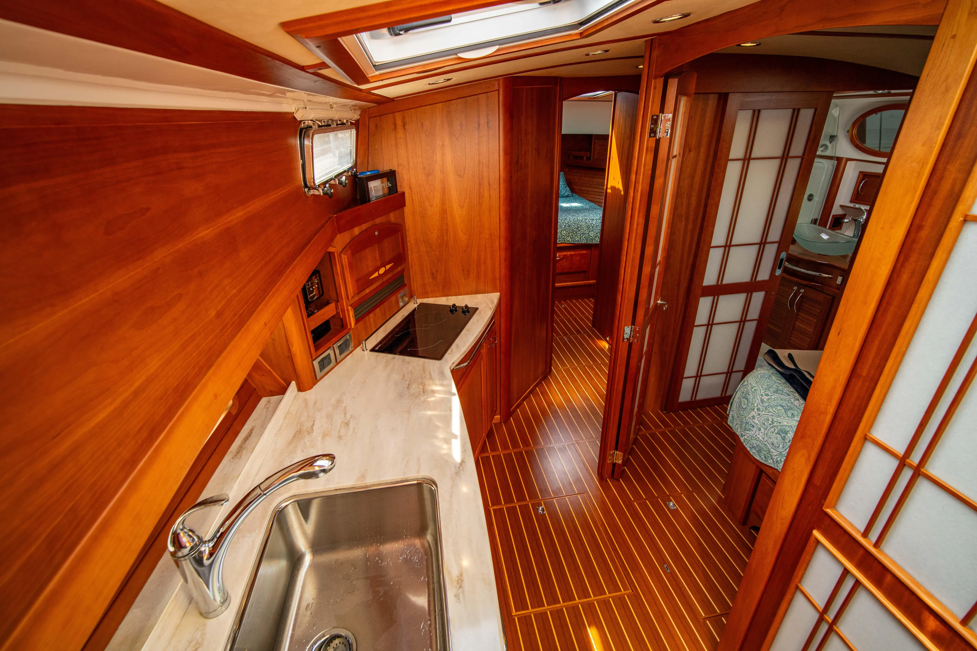  Yacht Photos Pics 2015 Sabre 48 Salon Express interior with wood finish and modern amenities.